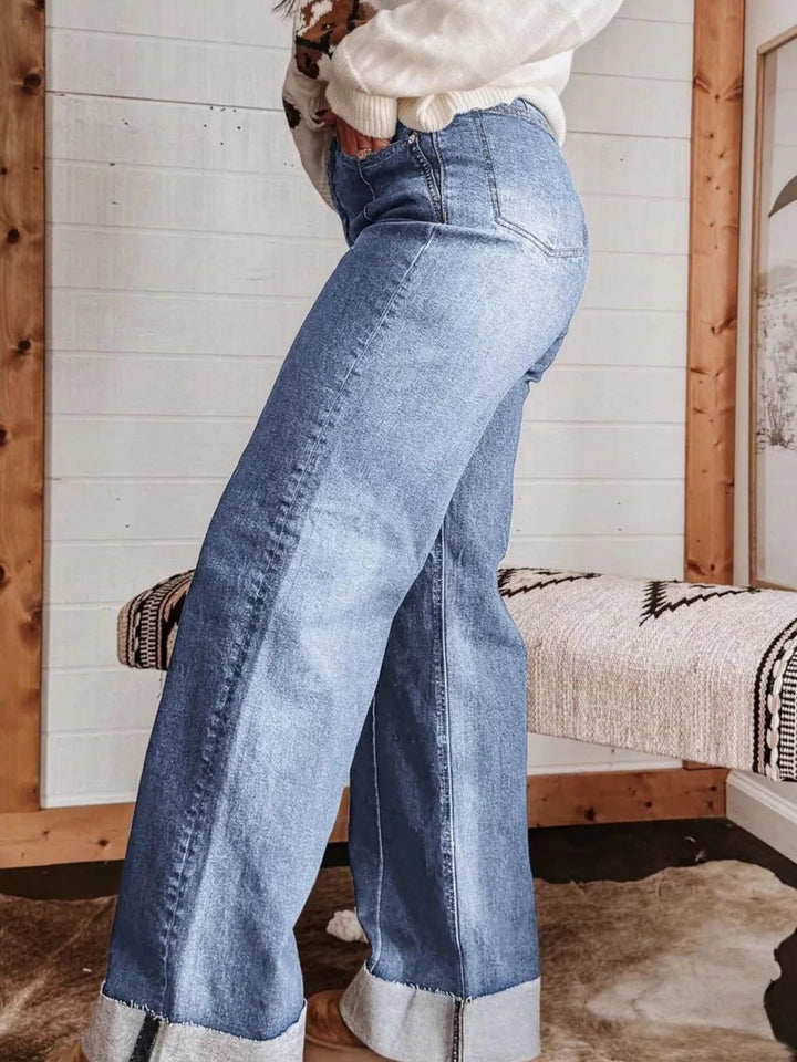 High-rise wide leg jeans with center seam and raw hem