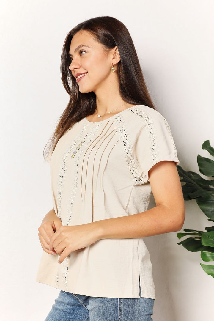 Crochet trim pintuck short sleeve top with button placket