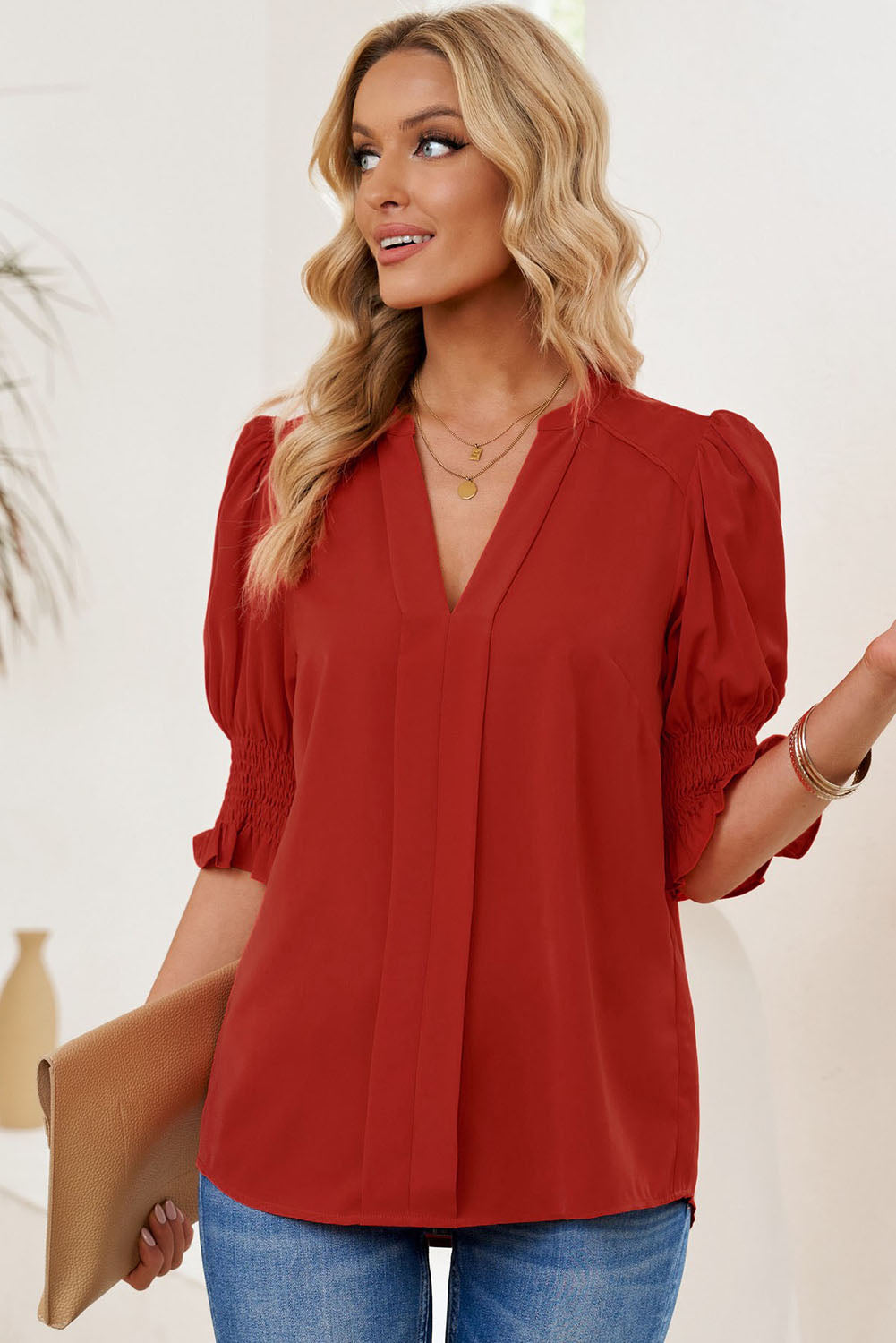 Notched neck blouse with smocked flounce sleeves