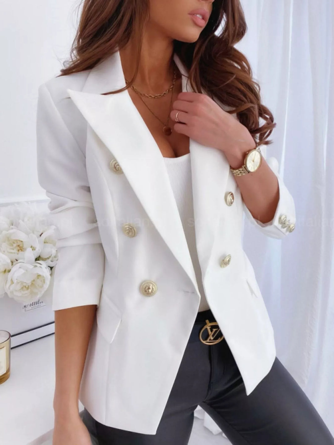 Double-breasted blazer with gold buttons and peak lapels