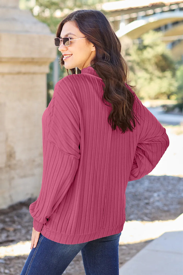 Ribbed exposed-seam mock neck knit top with drop shoulders