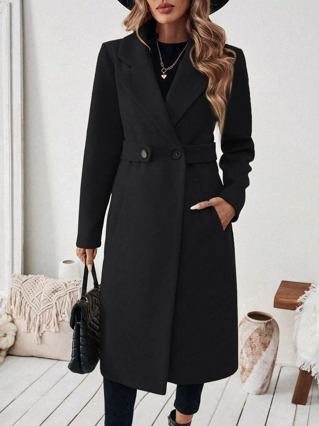 Longline notch lapel coat with single-button waist tab
