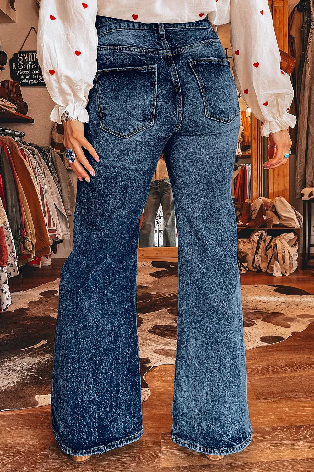 Acid wash high-rise wide flare jeans with double-button waist
