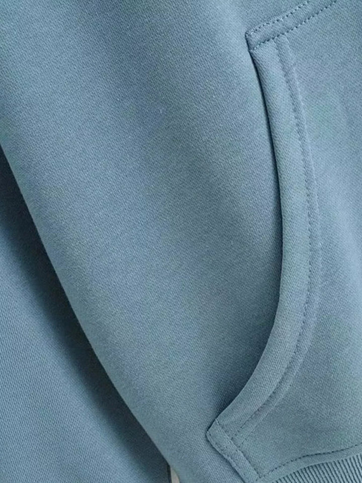 Oversized zip-up hoodie with drawstring hood and front pockets