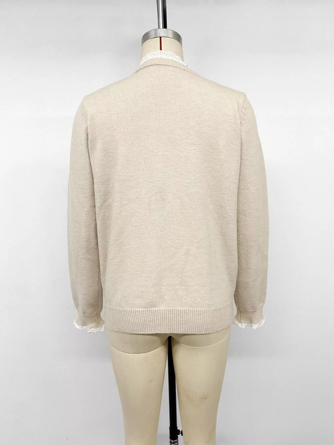 Lace trim crew neck knit sweater with ribbed cuffs