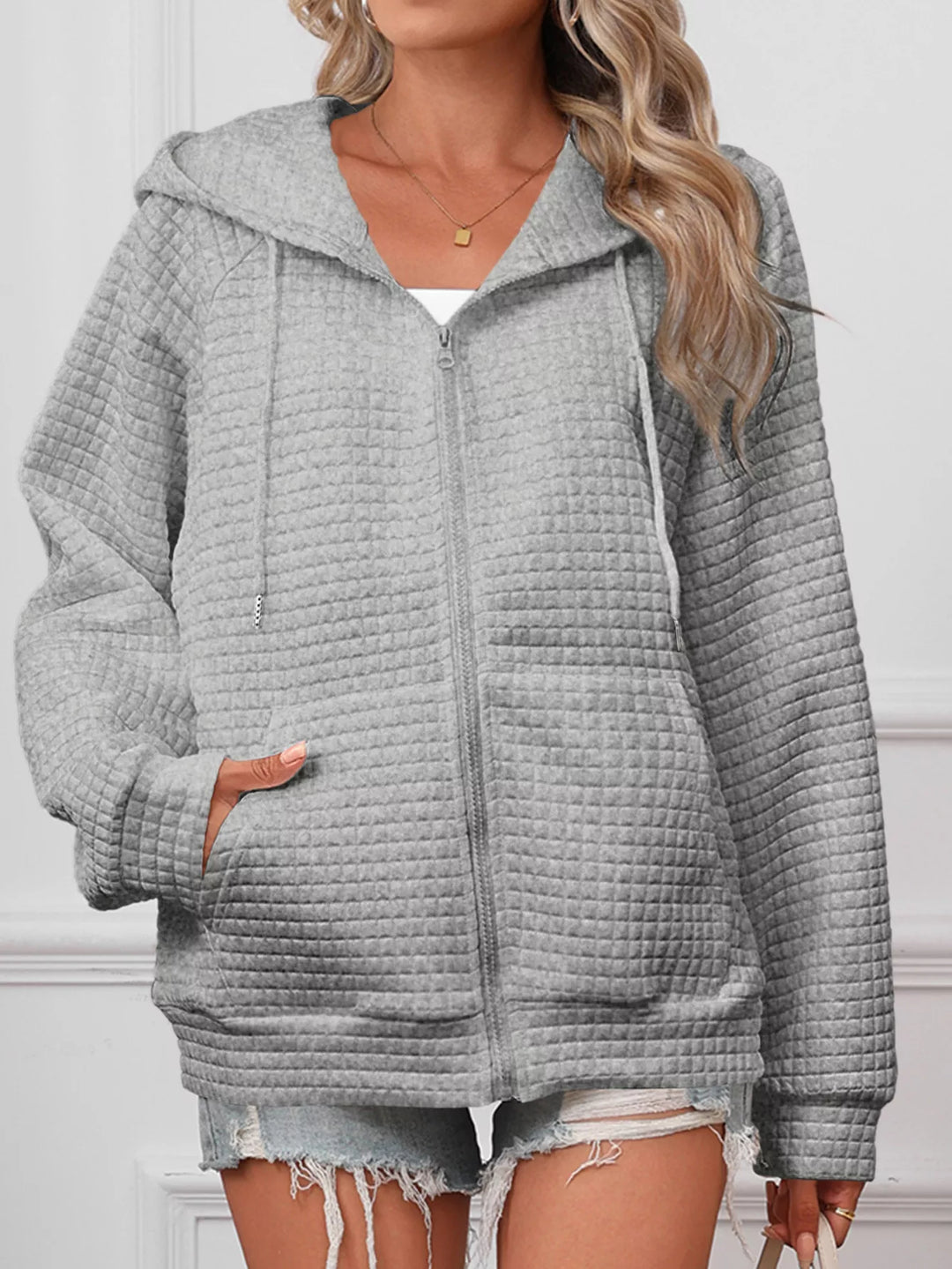 Textured quilted zip-up hooded jacket with pockets
