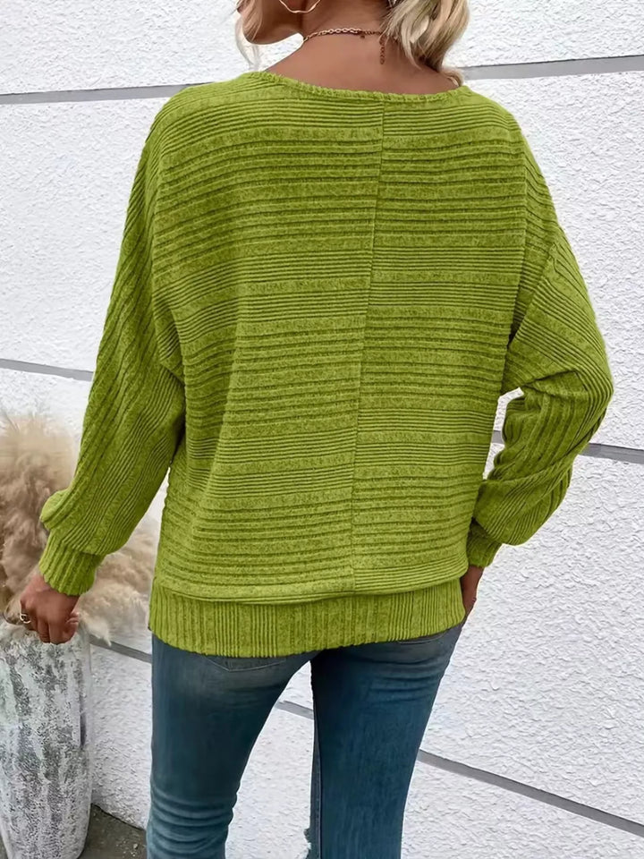 Ribbed knit quarter-zip batwing sweater with O-ring pull