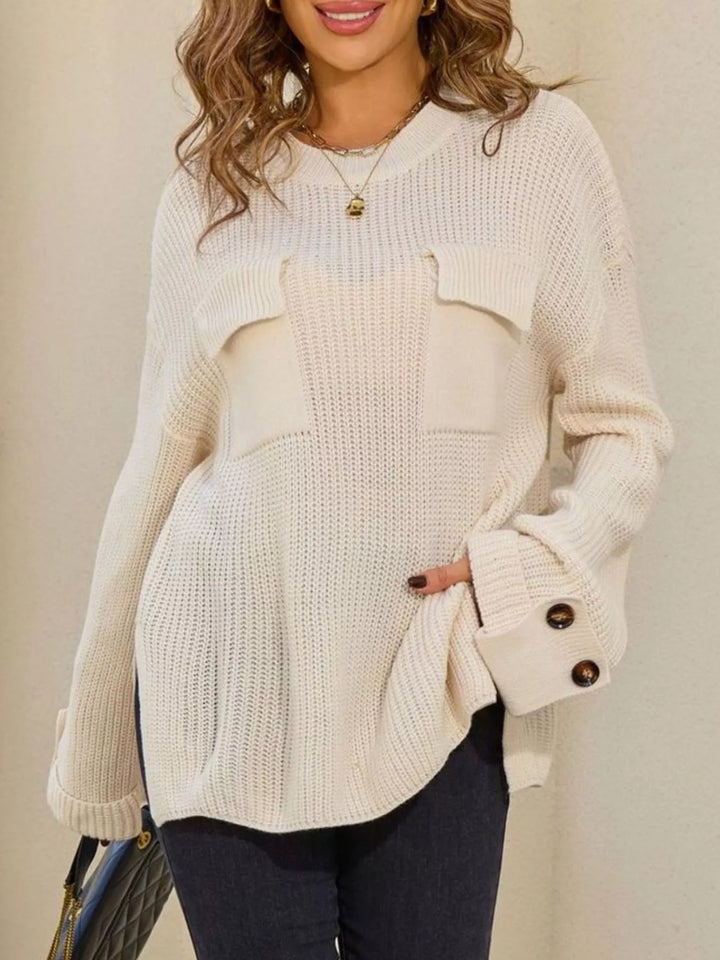 Ribbed knit sweater with chest pockets and button cuffs