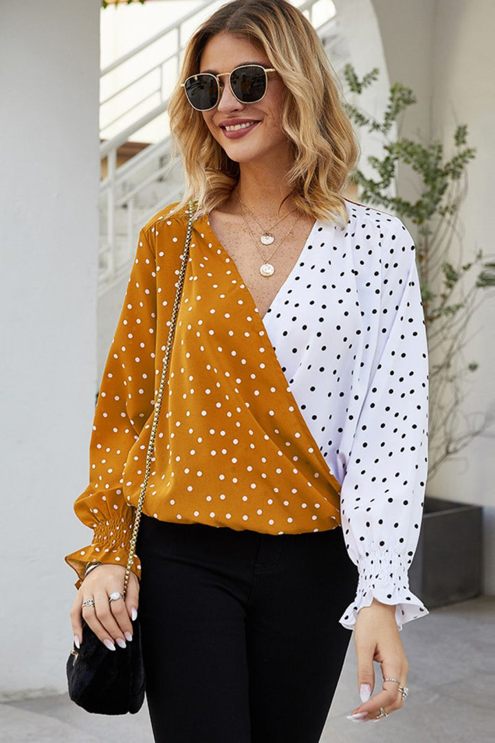 Color-block polka dot surplice blouse with lantern sleeves