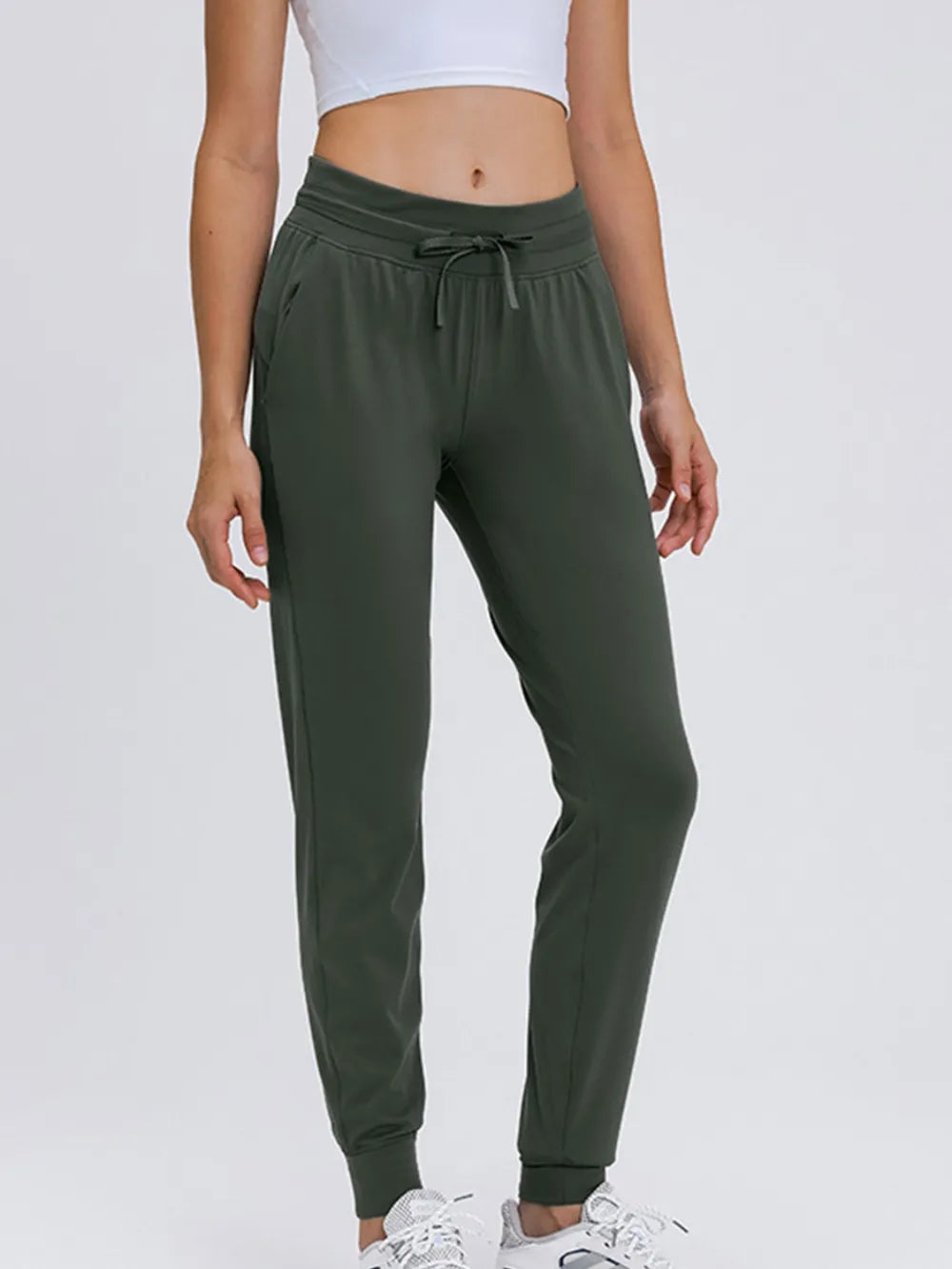 Army Green Tapered stretch nylon joggers with drawstring waist and pockets