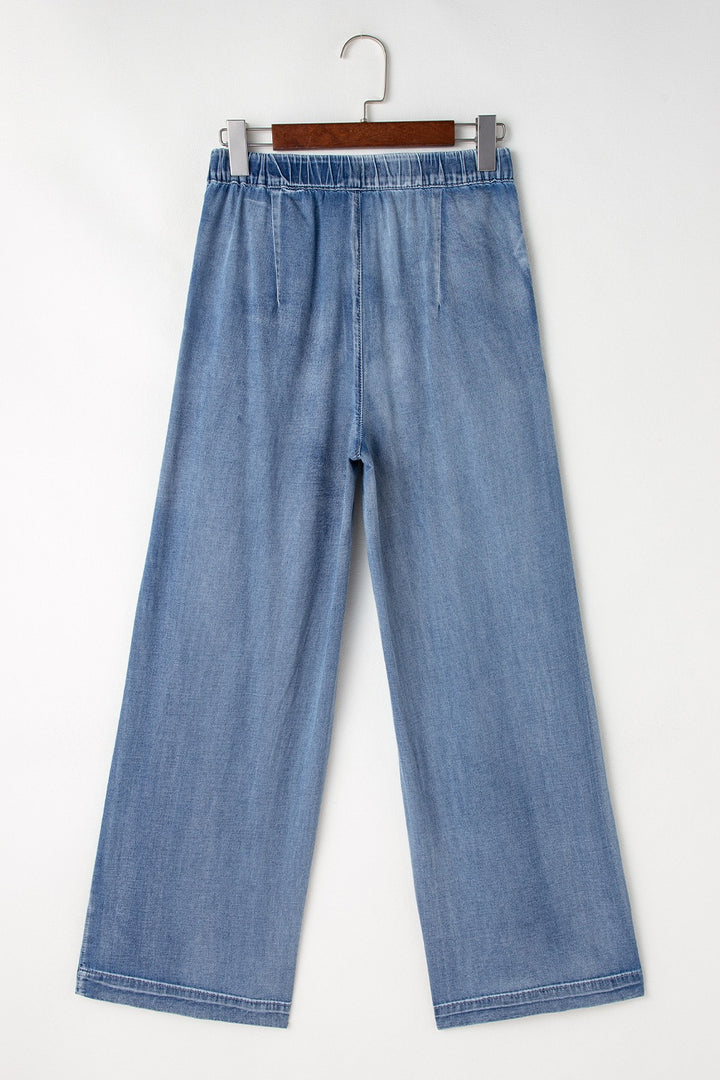 Pleated high-rise wide-leg jeans with deep pockets