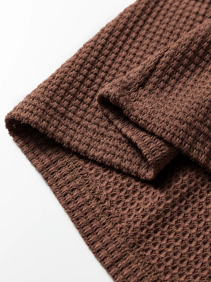 Waffle knit half-button hooded pullover with contrast trim
