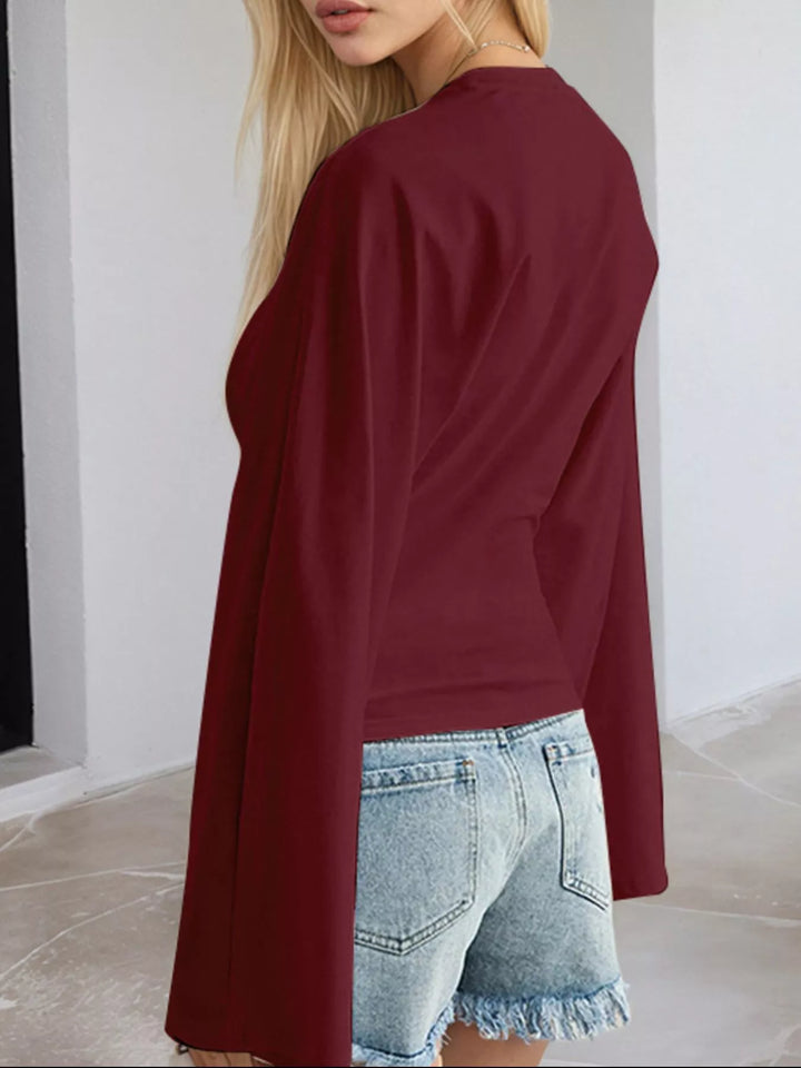 Fitted long sleeve top with flared bell sleeves
