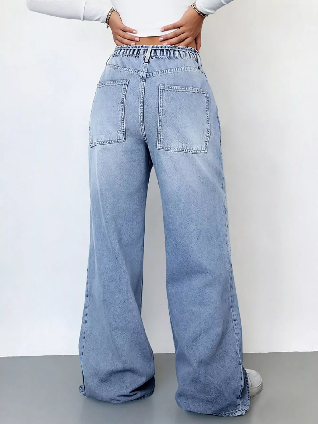 High-rise wide-leg cargo jeans with tie waist