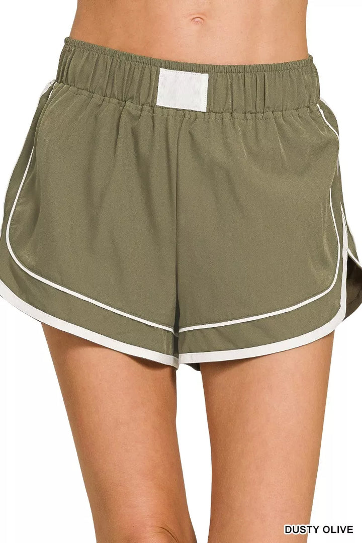 DUSTY OLIVE Woven dolphin-hem shorts with contrast piping and inner lining