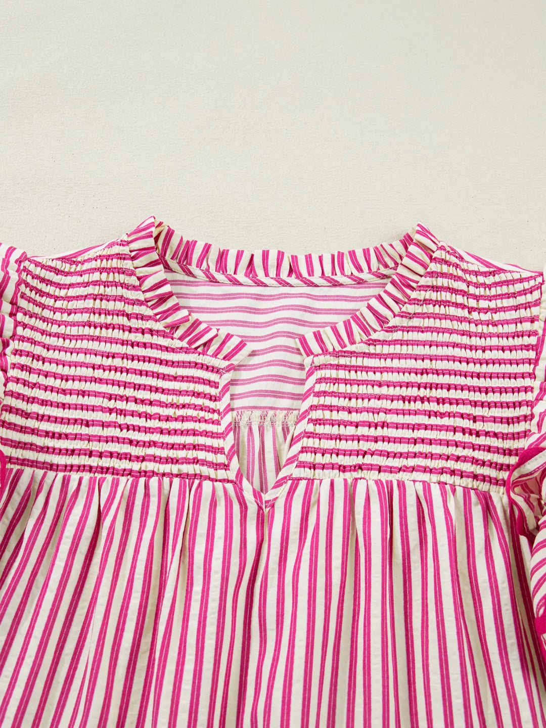 Striped shirred-yoke blouse with ruffled flutter sleeves