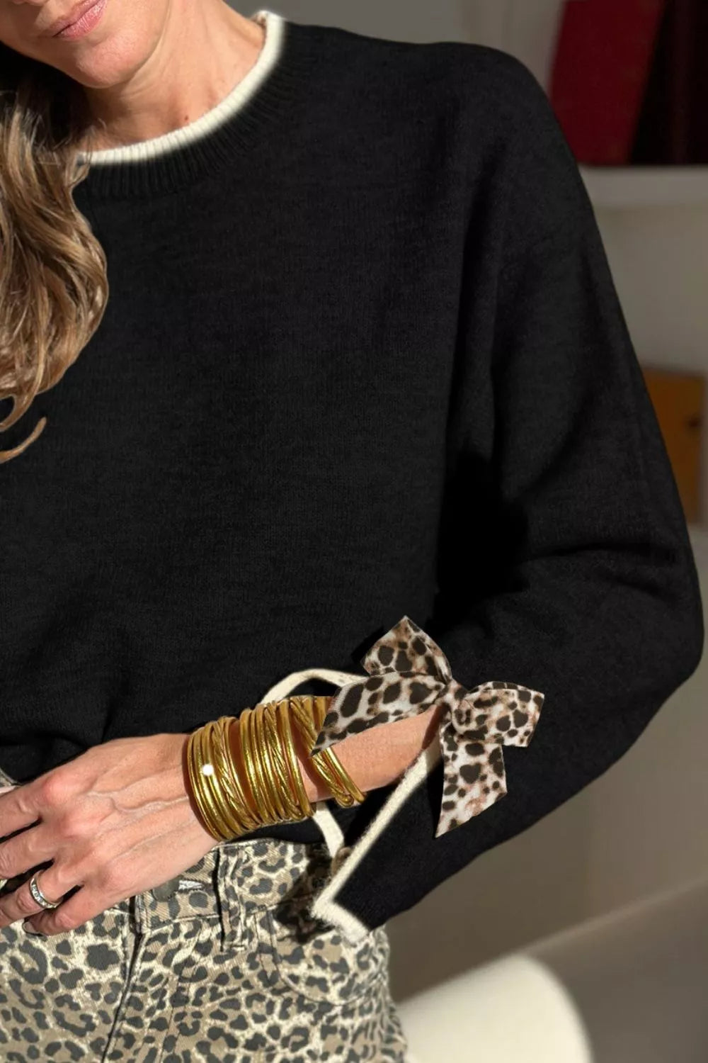 Leopard bow split-cuff contrast trim sweater