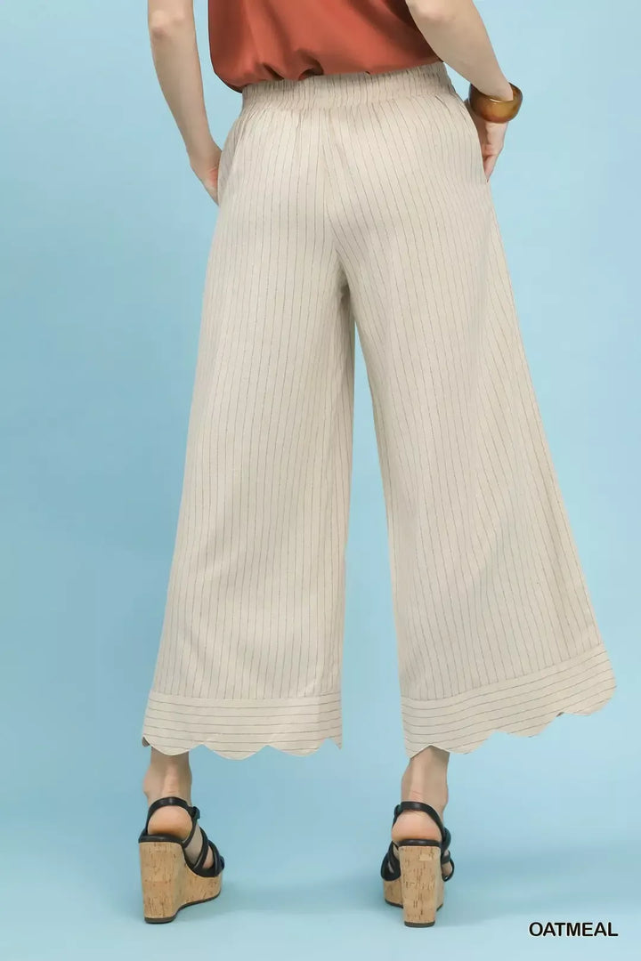 Pinstripe wide-leg linen pants with scalloped hem
