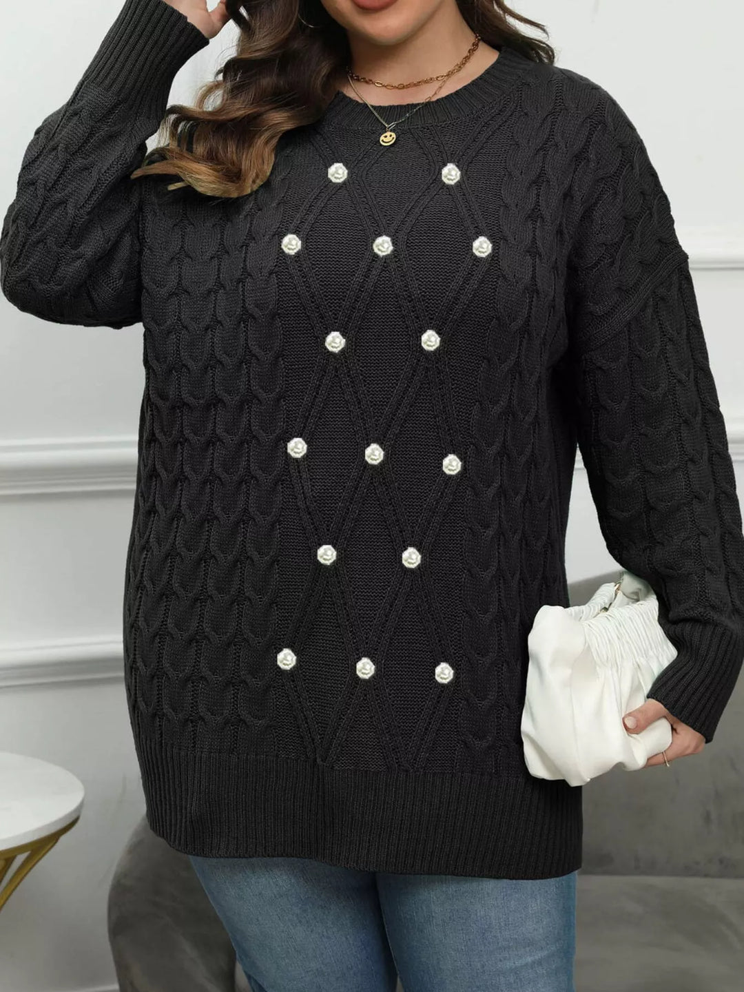 Cable knit dropped shoulder sweater with floral buttons