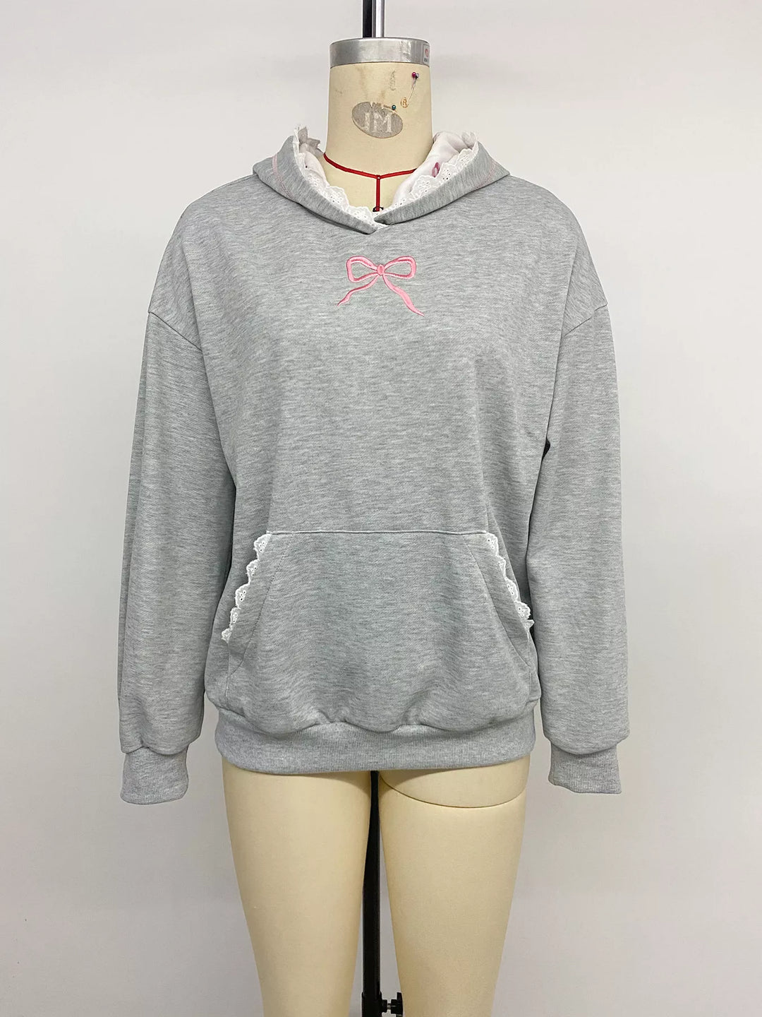Bow embroidered hoodie with lace trim and front pocket
