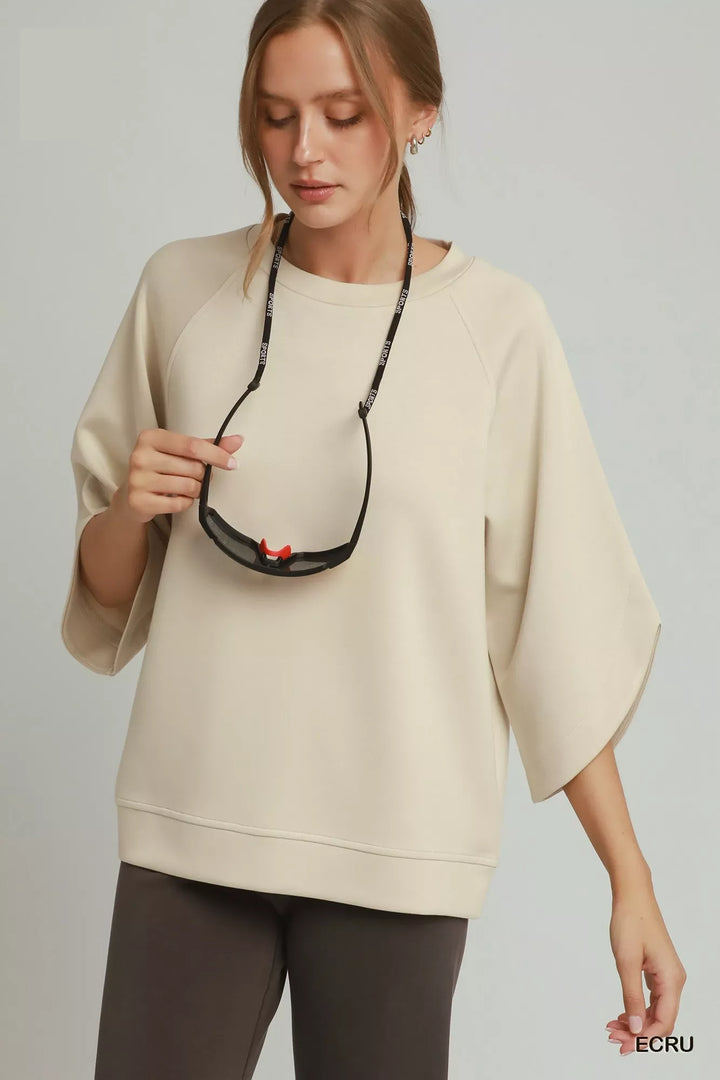 Relaxed raglan pullover with wide sleeves and ribbed hem