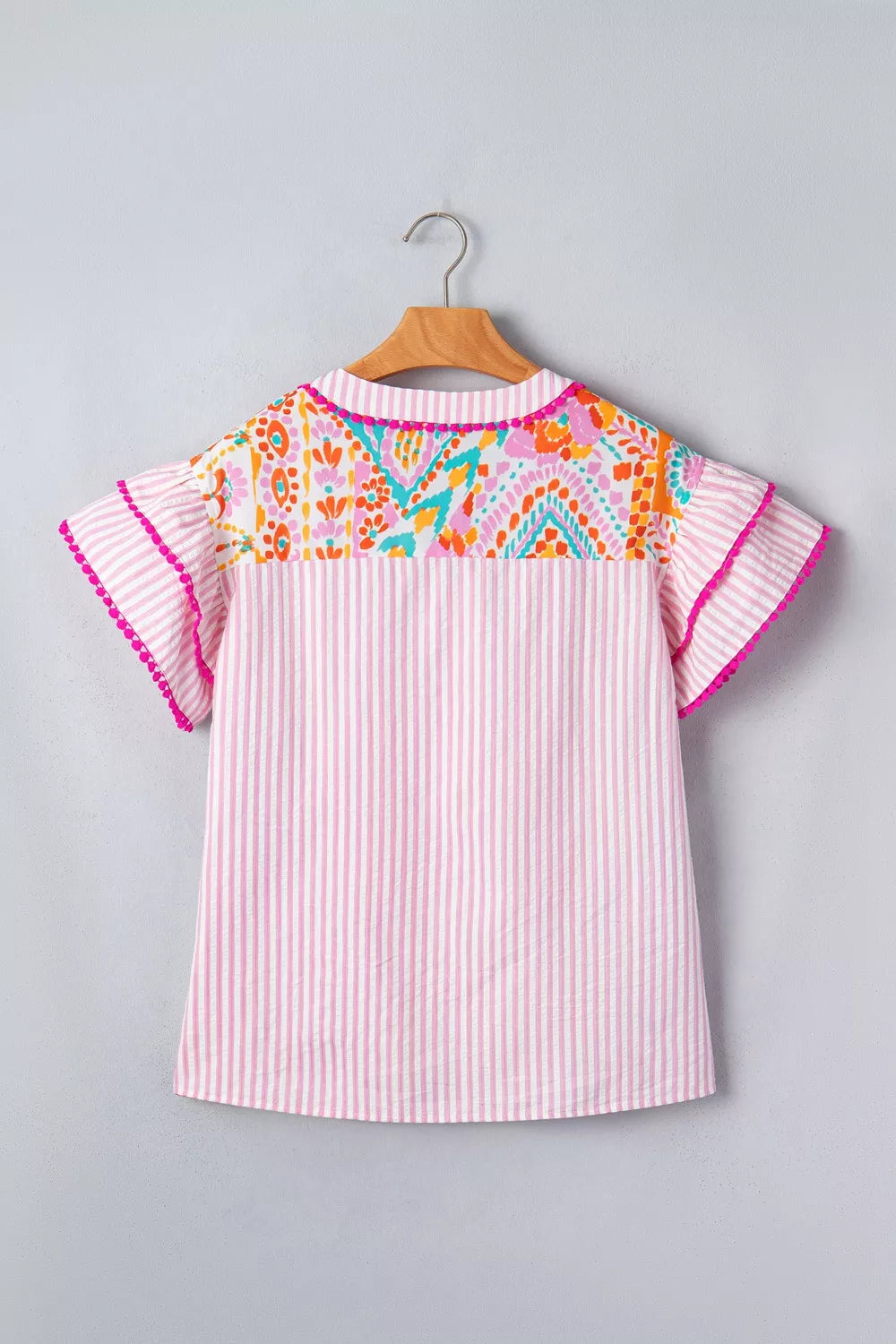 Patchwork mixed print blouse with ruffle sleeves and pom-pom trim