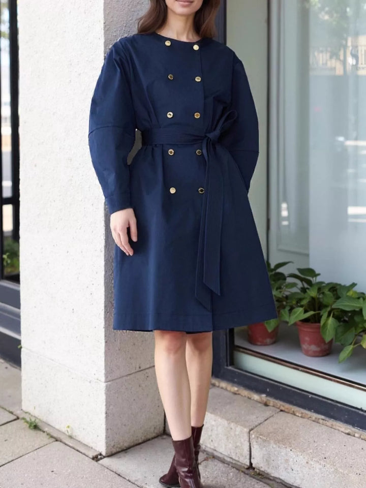 Collarless double-breasted belted trench coat with gold buttons