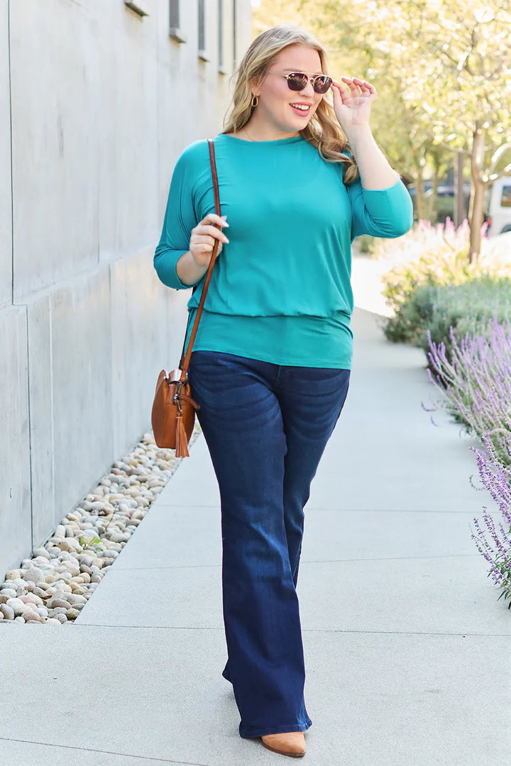 Batwing sleeve top with banded blouson hem