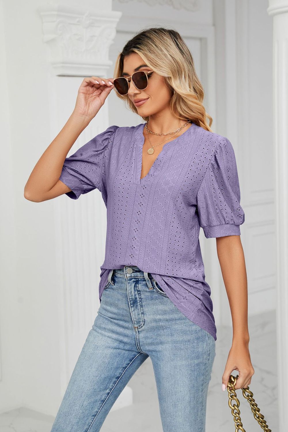 Eyelet puff sleeve top with notched V-neck