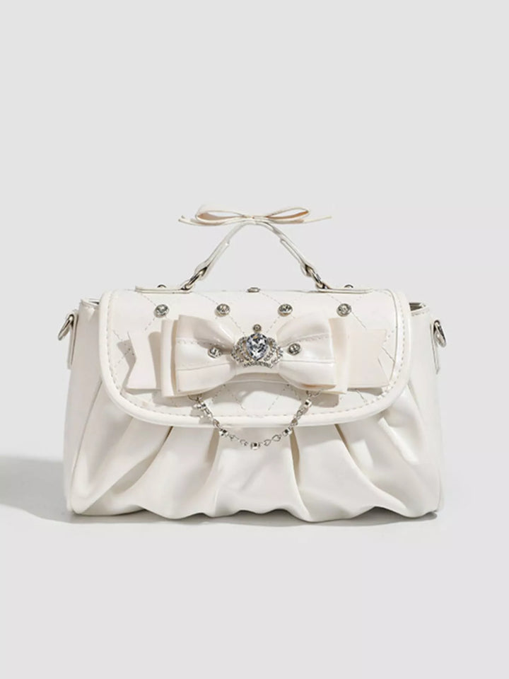 Ruched bow crossbody bag with rhinestone chain strap