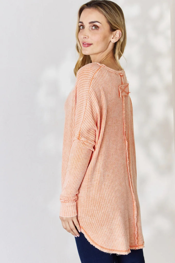 Oversized waffle knit long sleeve top with exposed seams