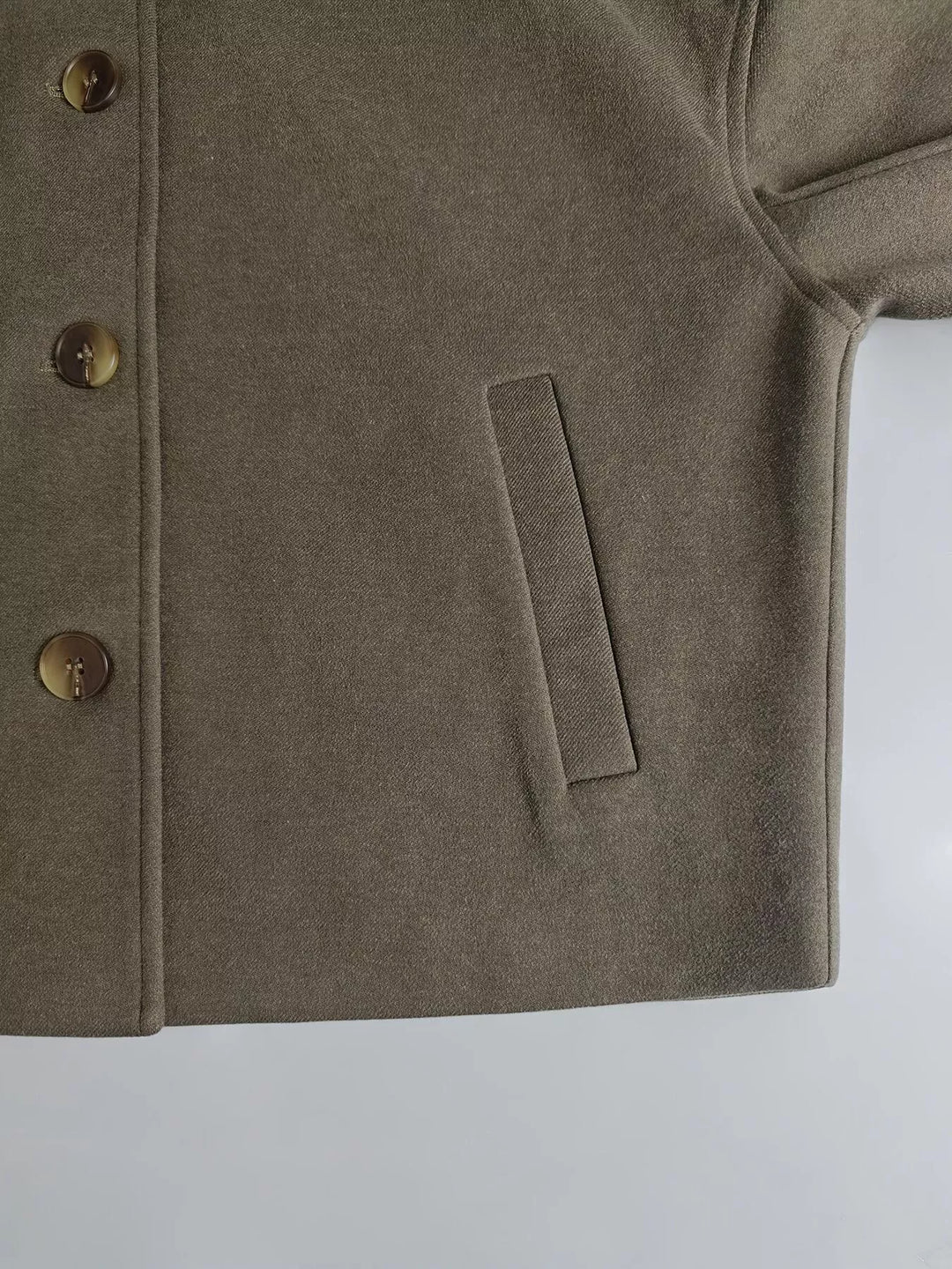 Cropped wool-feel jacket with dropped shoulders and slash pockets