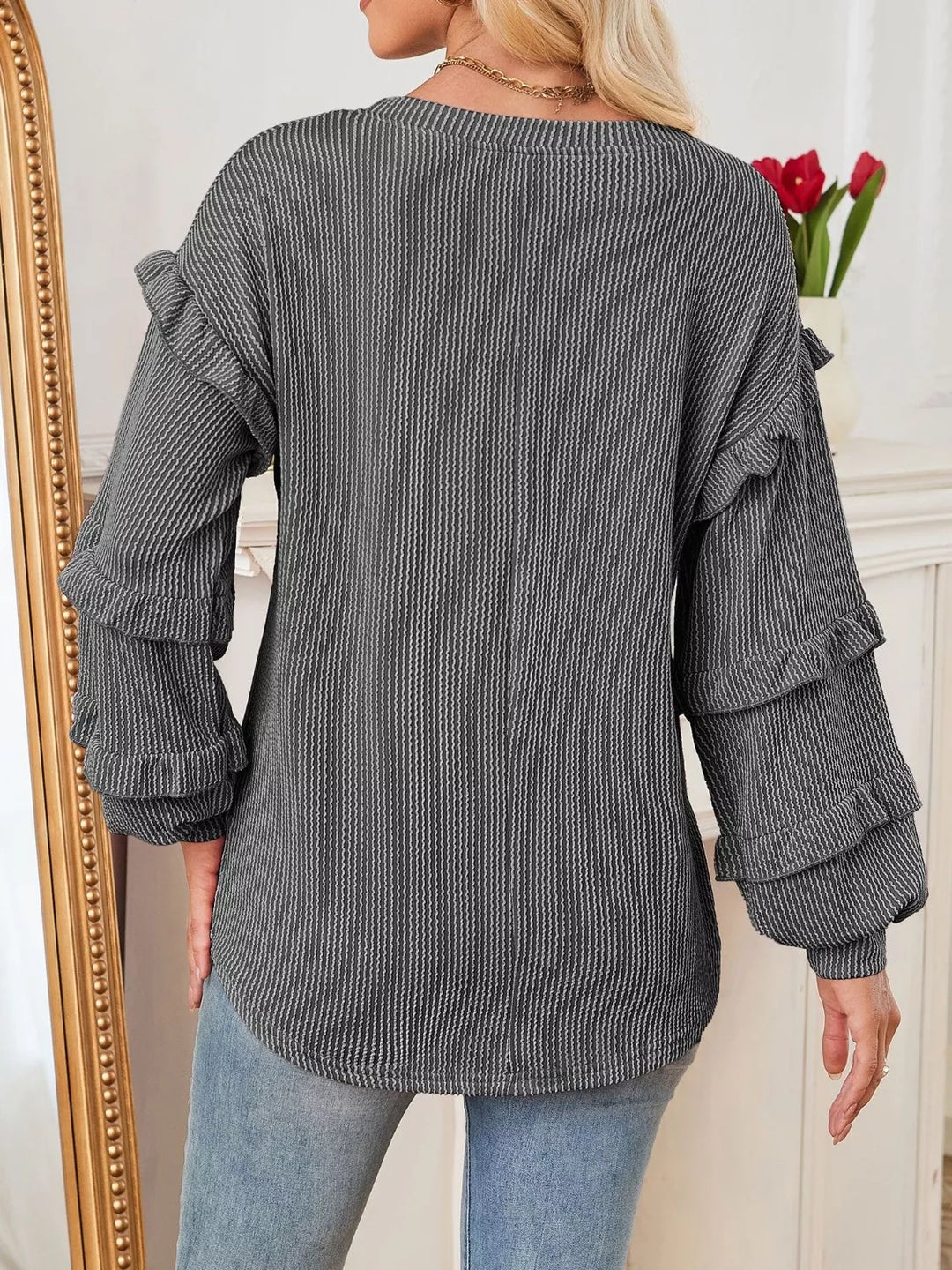 Ribbed knit top with ruffle-tiered long sleeves