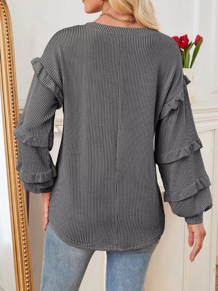 Ribbed knit top with ruffle-tiered long sleeves
