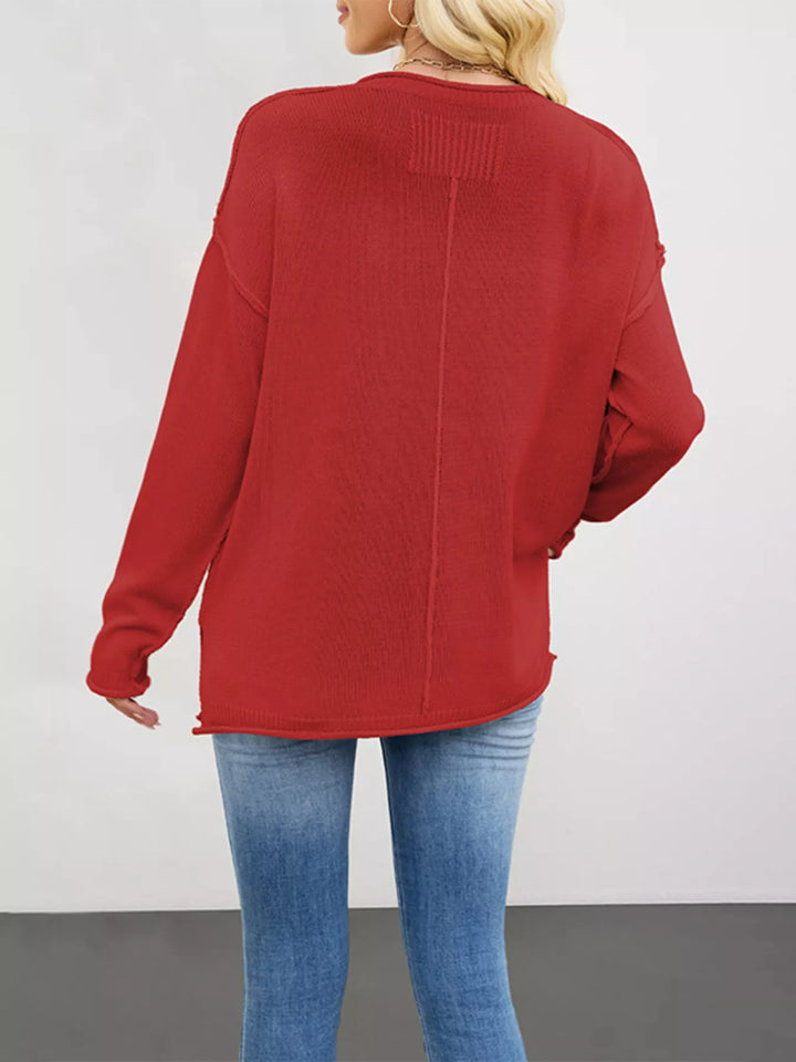 Exposed seam oversized crew neck sweater with raw hem