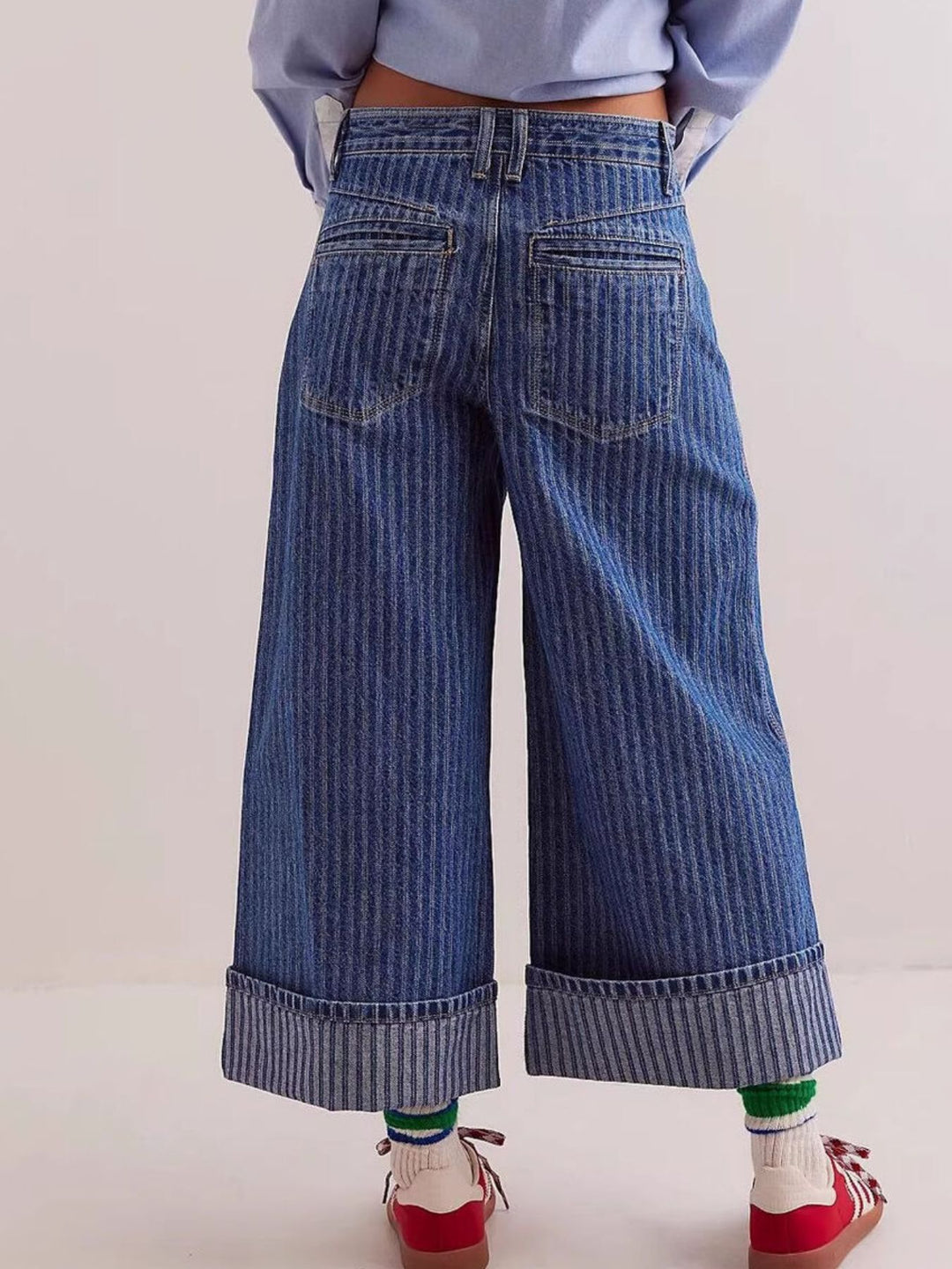 Wide-leg cropped jeans with deep cuffed hem and center seam