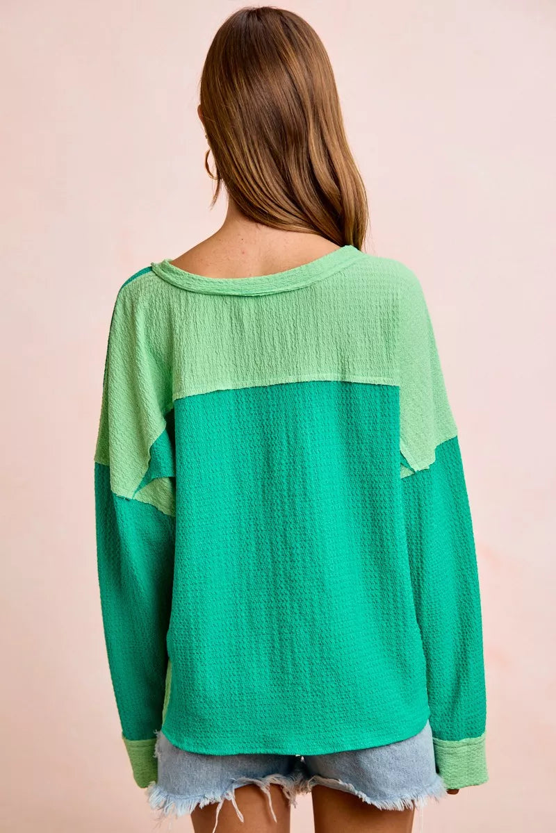 Color block long sleeve textured jersey top with raw-cut edges