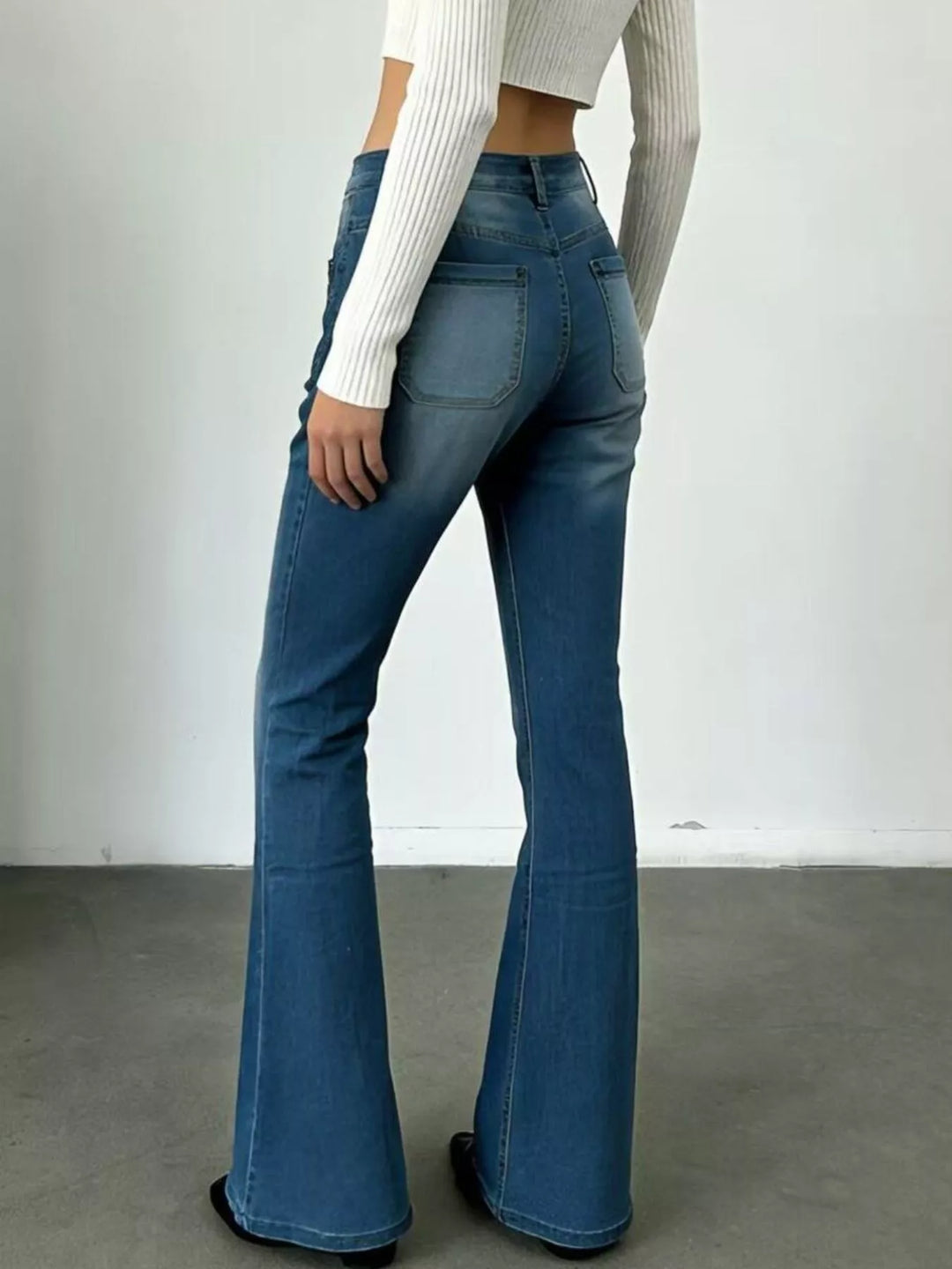 High-waisted button-fly flare jeans with patch pockets