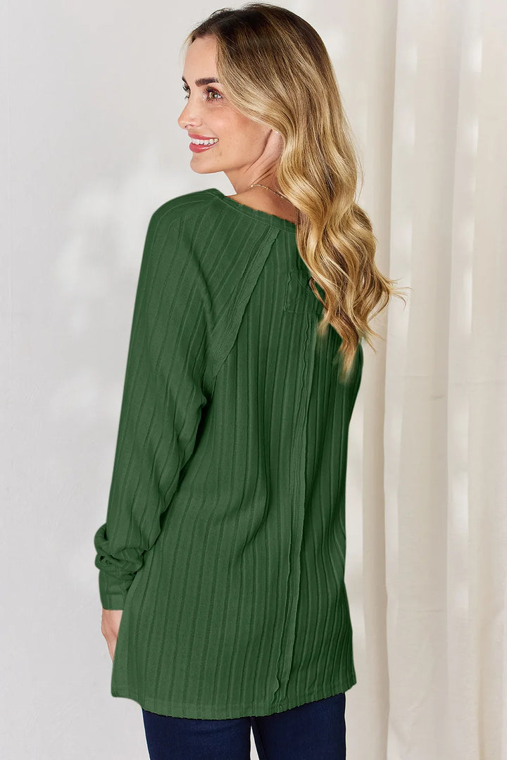 Ribbed knit round neck long sleeve top with side slits