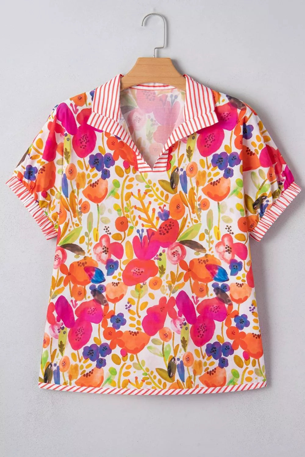 Floral print blouse with striped collar and cuff trim