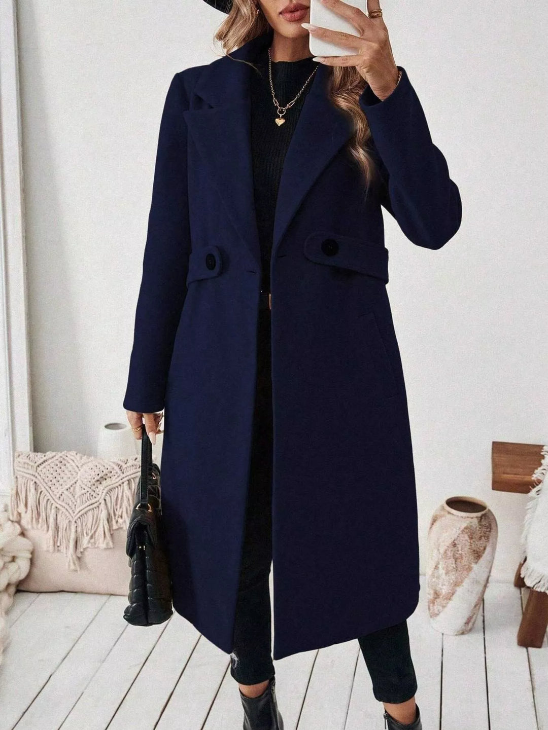 Longline notch lapel coat with single-button waist tab