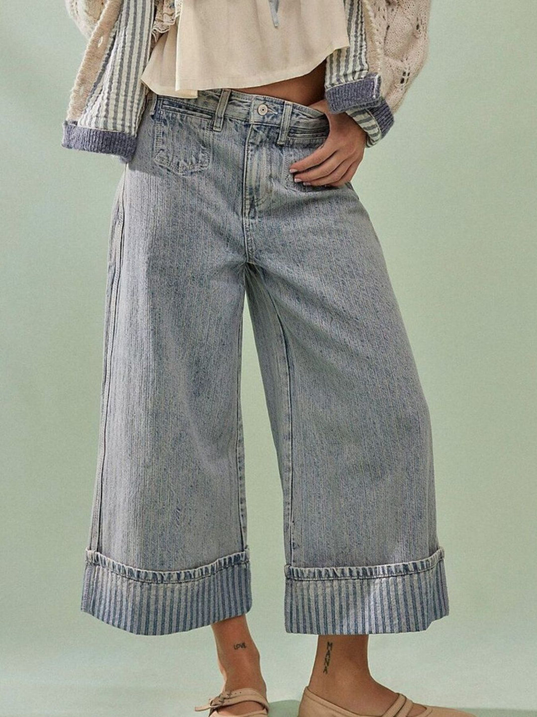 Wide-leg cropped jeans with deep cuffed hem and center seam