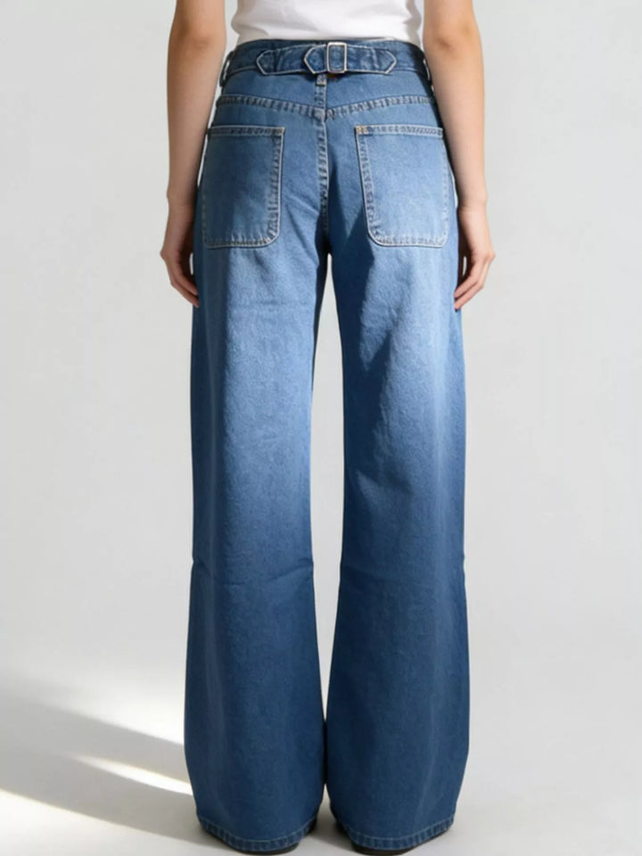 High-rise wide-leg jeans in faded mid-wash denim