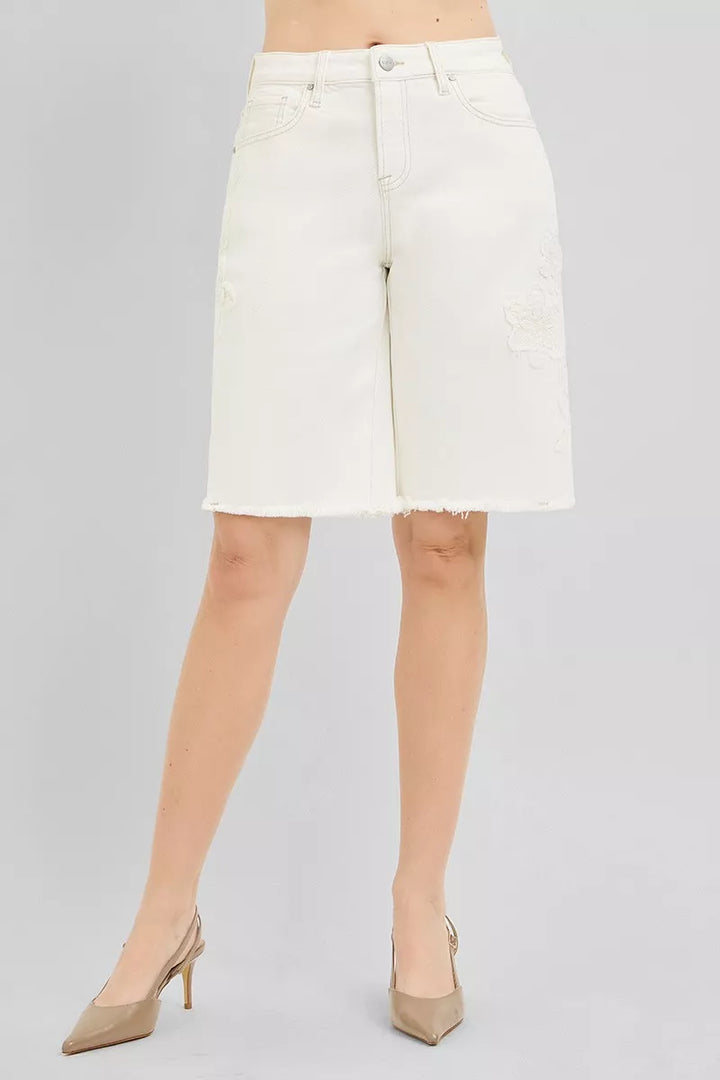 Relaxed Bermuda denim shorts with floral embroidery and raw hem