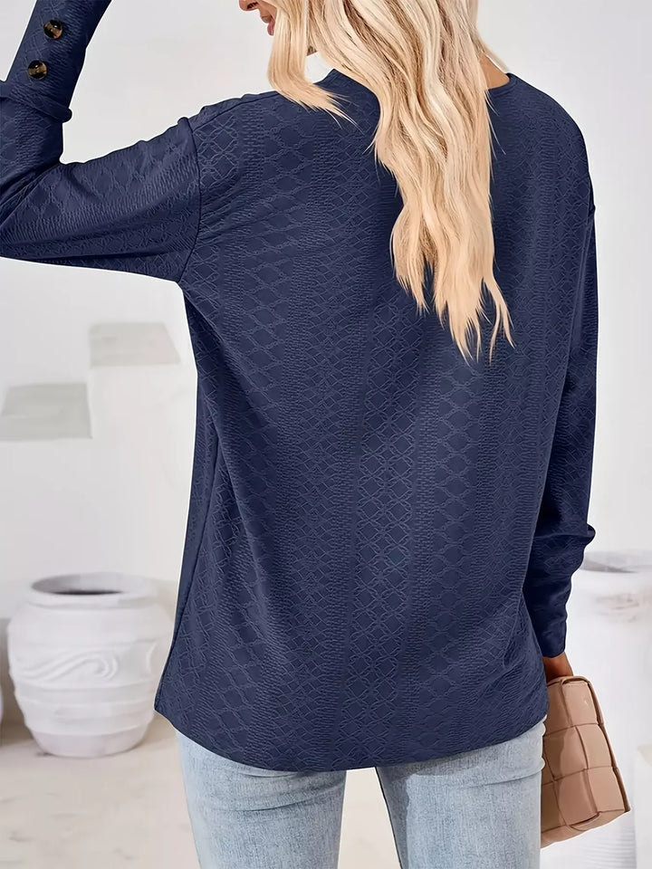 Plus size textured V-neck long sleeve top with button cuffs
