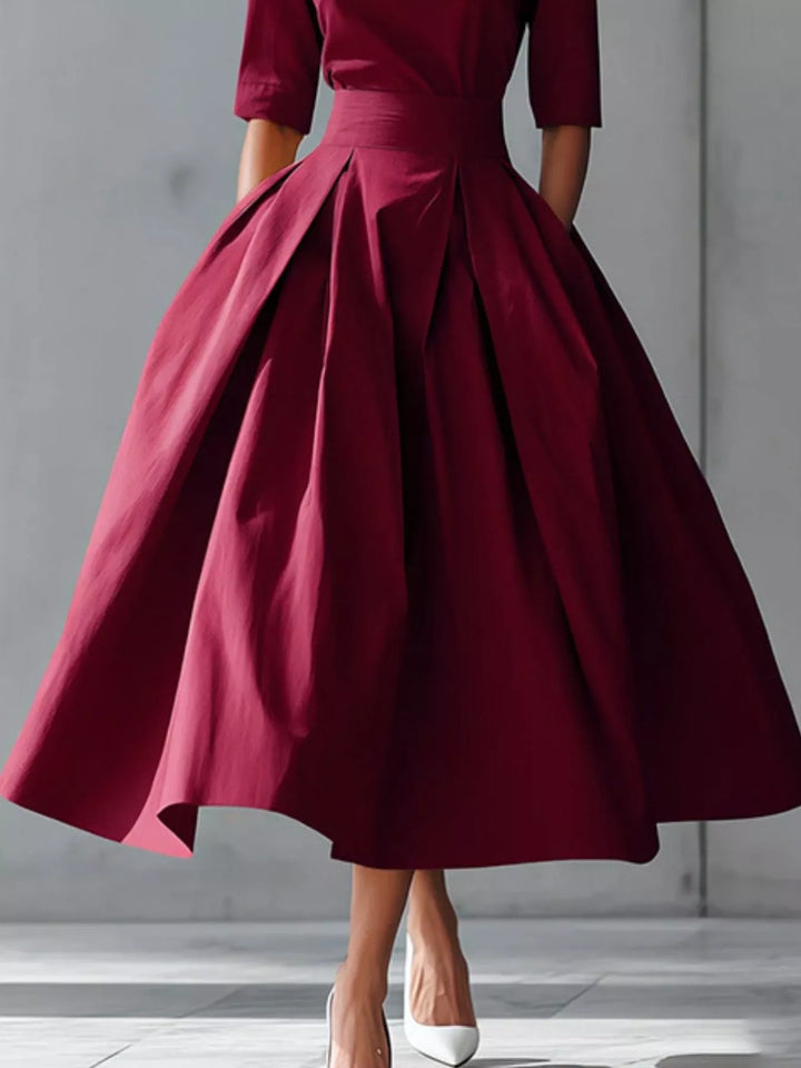 A-line pleated midi dress with side pockets