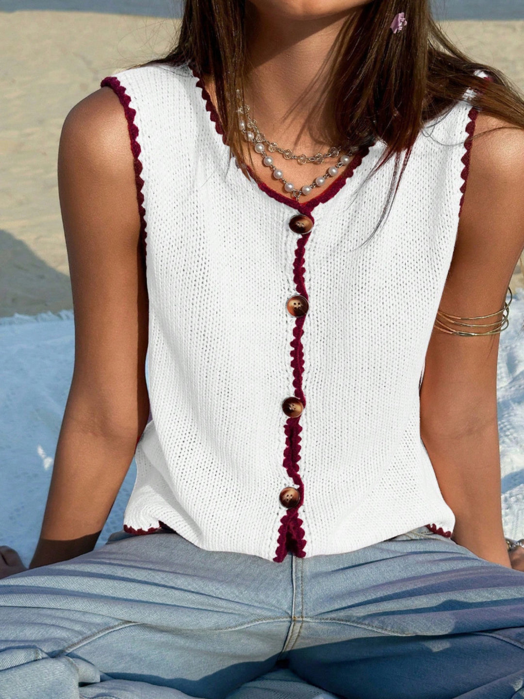 Button-front knit sweater vest with contrast whipstitch trim