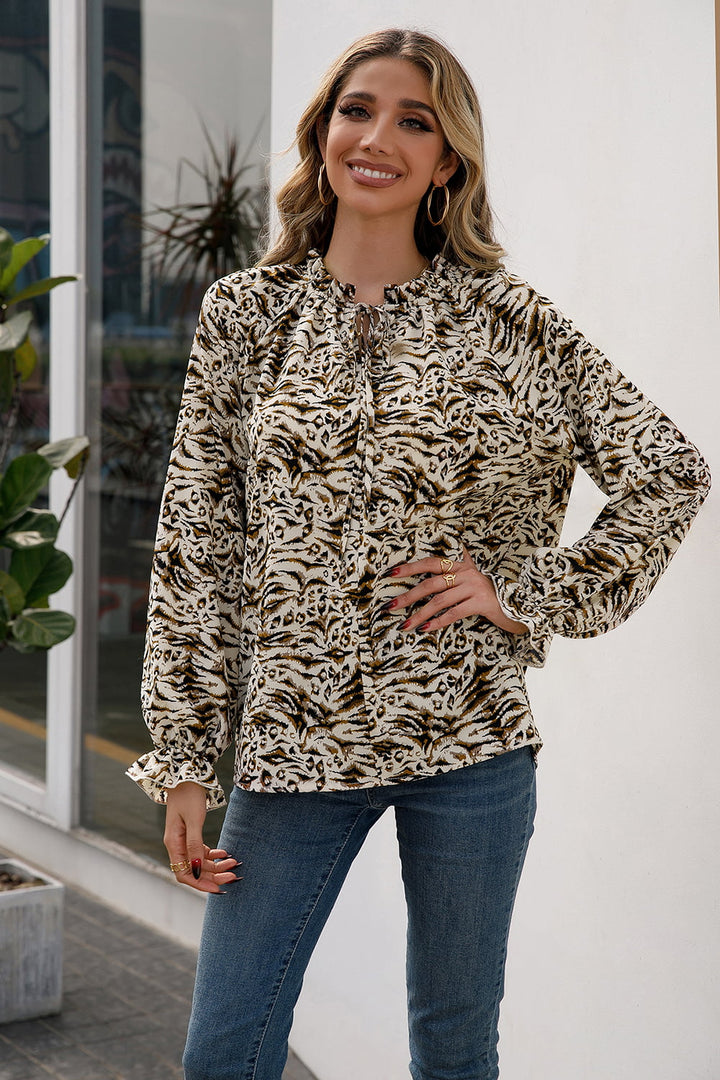 Animal print tie-neck blouse with flounce sleeves