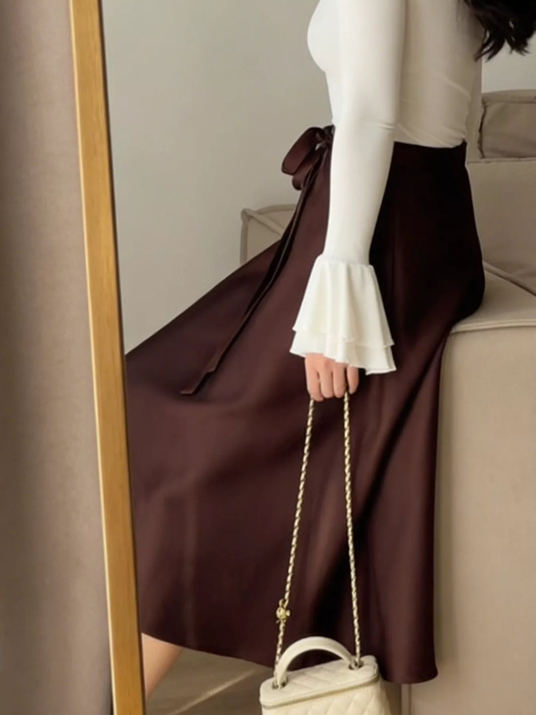 High-waist satin A-line midi skirt with tie bow