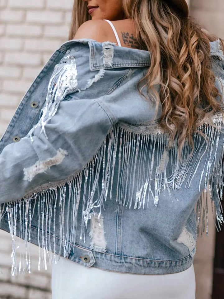 Distressed denim jacket with sequin fringe and chest pockets